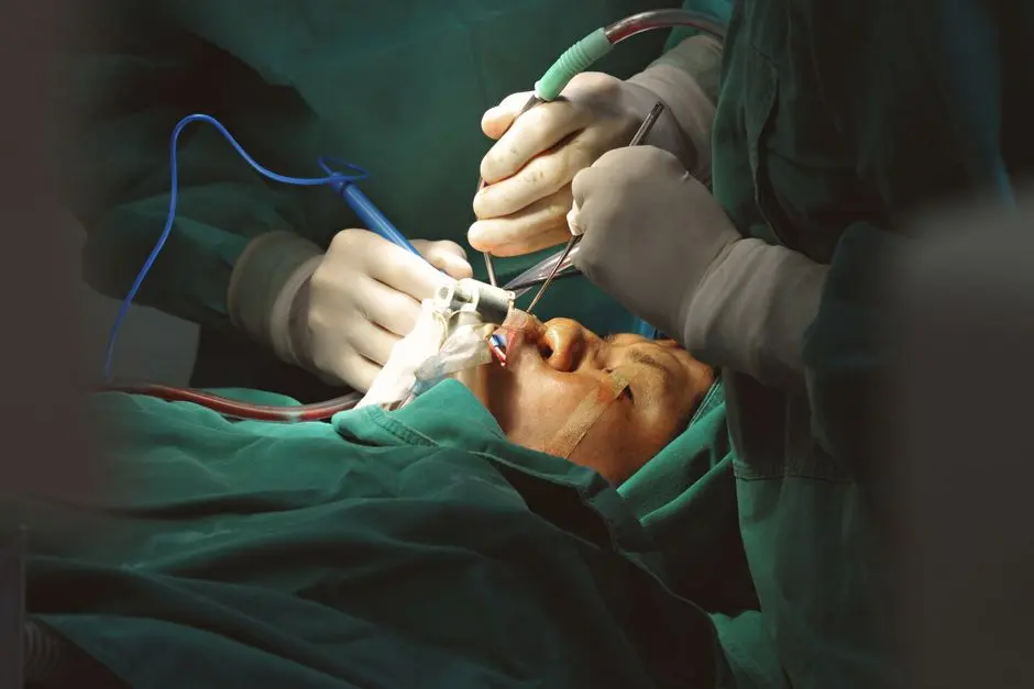 Surgeons in sterile environment performing delicate facial surgery with precision instruments.