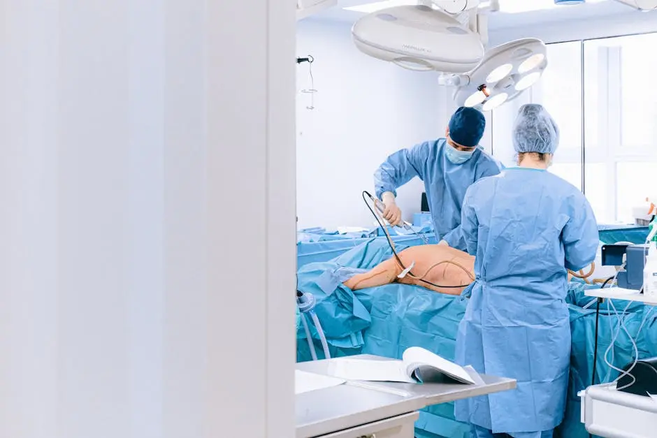 Two surgeons in a sterile operating room performing surgery on a patient.